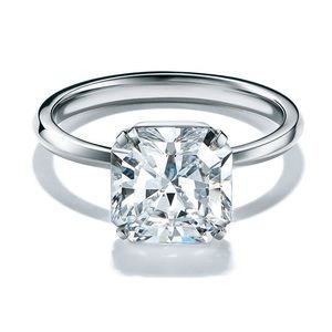 Tiffany True engagement ring (.64k)& Tiffany Metro eternity band both platinum.